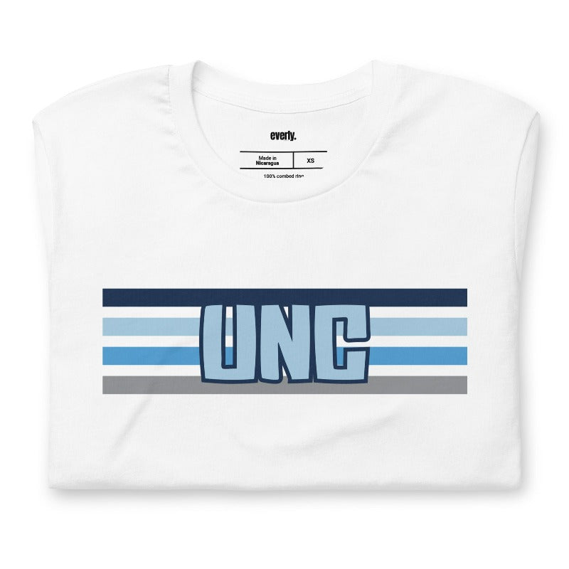 The letters "UNC" in bold blue over blue and white stripes for the University of North Carolina on a white shirt.