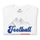 "Football," "The Perfect Sunday," and "Beer" in blue, red, and glittery blue lettering. The design includes a mountain backdrop and a goalpost, capturing the spirit of a perfect football Sunday on a white shirt.