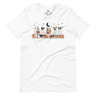 White t-shirt featuring a row of dogs dressed in ghost costumes with pumpkins, perfect for Halloween fun and dog lovers.