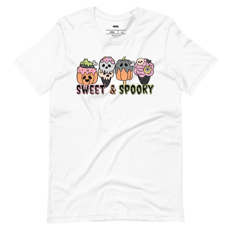 White t-shirt featuring a fun 'Sweet & Spooky' design with Halloween-themed ice cream cones, skulls, pumpkins, and spooky treats.