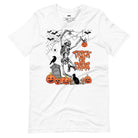 White t-shirt with a fun Halloween design featuring a skeleton, pumpkins, bats, and "Trick or Treat" text in a festive orange and black theme.