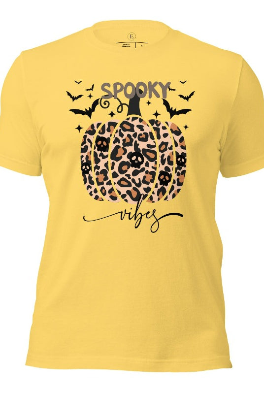 Get into Halloween spirit with our spooky vibes shirt featuring a unique cheetah print pumpkin adorned with skulls. As bats soar across the starry sky, embrace the eerie charm of this one-of-a-kind design on a yellow shirt. 