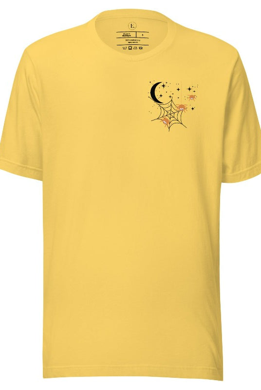 Embrace the enchanting night sky with our captivating t-shirt. Featuring a crescent moon, stars, and a spiderweb with three adorable spiders hanging down on the front pocket on a yellow shirt. 