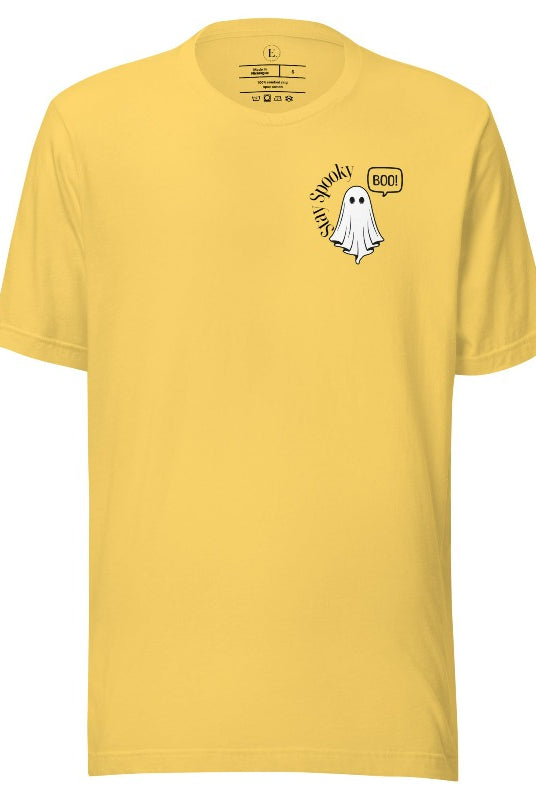 Get into the Halloween spirit with our spooktacular t-shirt. Featuring a friendly ghost holding a sign that says 'Boo' and the playful phrase "Stay Spooky" on a yellow shirt. 