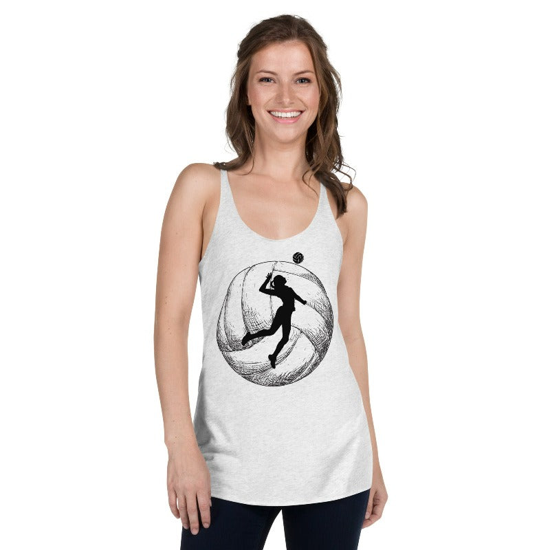 A women's Next Level Racerback tank top in heather white, featuring a large black silhouette of a volleyball player mid-jump with a volleyball backdrop. The tank is made from a blend of polyester, combed ring-spun cotton, and rayon, ensuring a soft and comfortable fit.