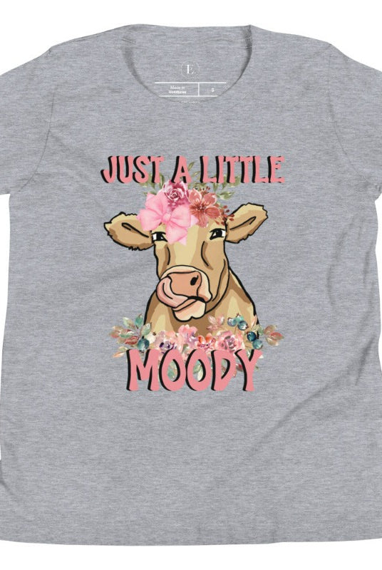 Our kid's shirt features an adorable highland cow with flowers and the quote 'Just a Little Moody,' adding humor and personality to the design on an athletic heather grey shirt. 