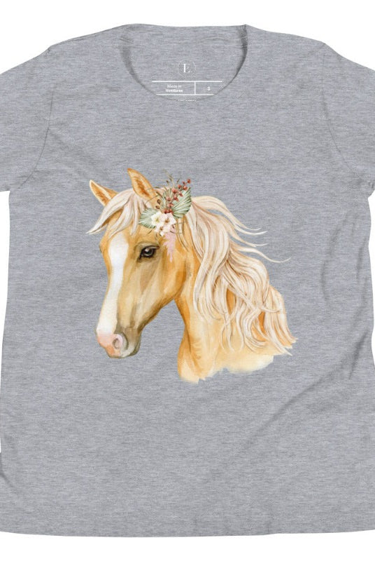Embrace the equestrian vibe with our kids' shirt which features a majestic horse head adorned with a beautiful floral arrangement on its mane on a white shirt on an athletic heather grey shirt. 