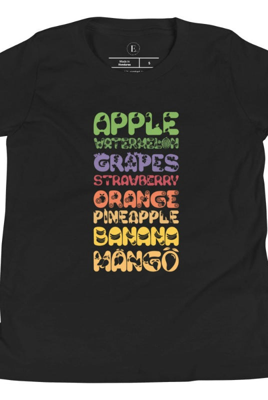 Our kid's shirt adds a burst of fruit fun! It features a colorful list of fruits, promoting healthy eating playfully on a black shirt .
