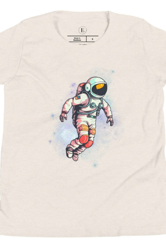 Embark on an intergalactic adventure with our captivating kids' shirt! Featuring a whimsical design of an astronaut floating in space on a heather dust shirt. 