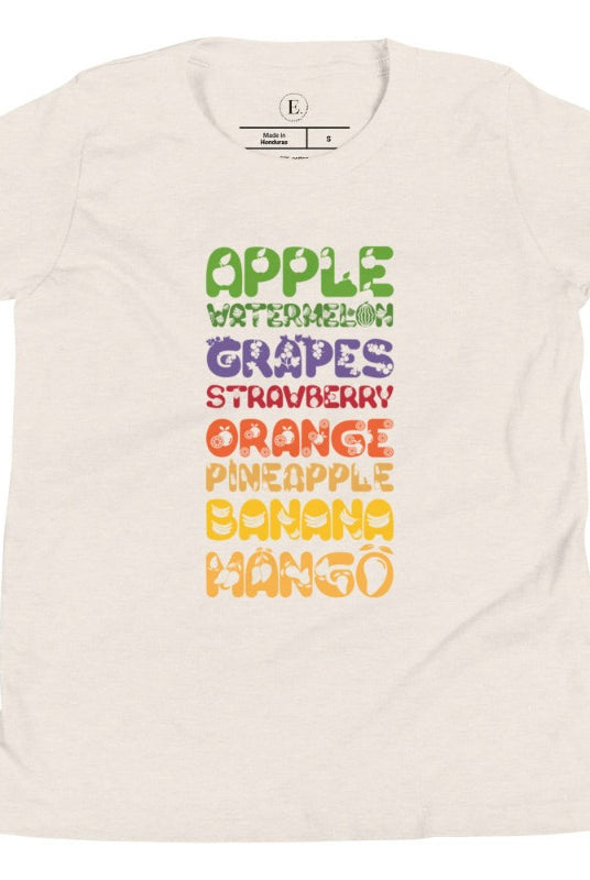 Our kid's shirt adds a burst of fruit fun! It features a colorful list of fruits, promoting healthy eating playfully on a heather dust colored shirt. 