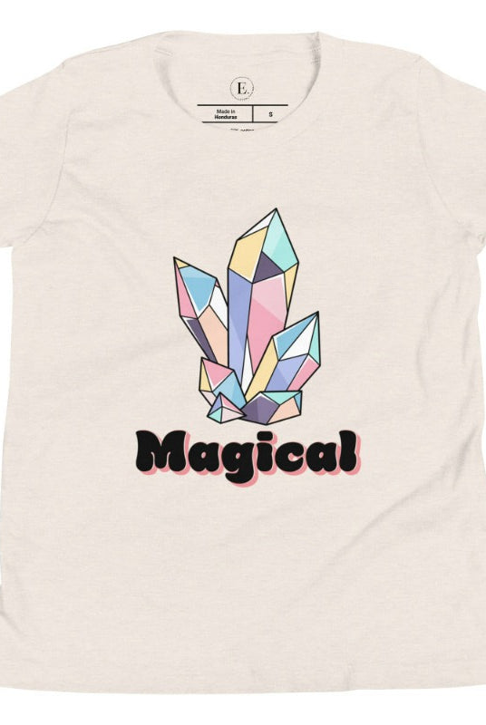 Our kids' shirt is designed to unleash your child's magic. Featuring colorful crystals and the word "Magical", it ignites your child's imagination on a heather dust colored shirt. 