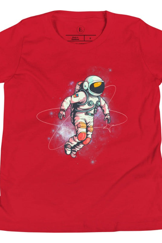 Embark on an intergalactic adventure with our captivating kids' shirt! Featuring a whimsical design of an astronaut floating in space on a red shirt. 
